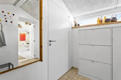 a kitchen with white cabinets and a mirror at 758-Vestervig-Vesterhavsvej-28 in Vestervig