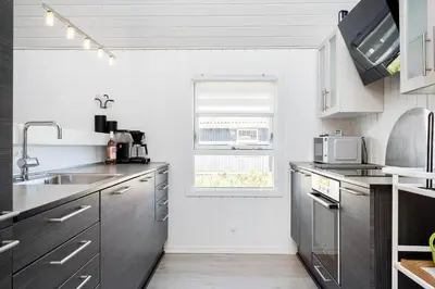 a kitchen with stainless steel appliances and a window at 144-Thisted-Nordsovej-204-D in Thisted