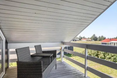 two chairs sitting on a porch with a roof at 144-Thisted-Nordsovej-204-D in Thisted