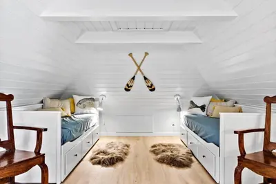 a white room with two beds and two chairs at 194-Vestervig-Vesterhavsvej-7-C in Vestervig