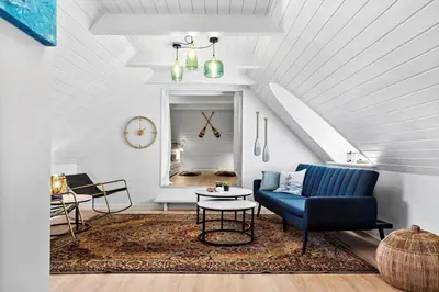 a living room with a blue couch and a table at 194-Vestervig-Vesterhavsvej-7-C in Vestervig