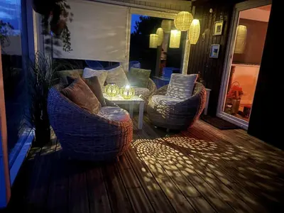 a living room with two chairs and a table at 162-Thisted-Molgaardsvej-62 in Thisted