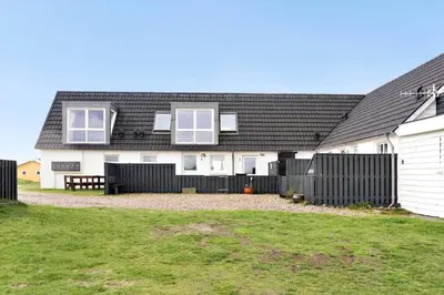 a white house with a black roof and a yard at 1012-Thisted-Trindbak-12-B in Torsted