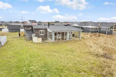 a small house in a field of grass at 529-Thisted-Nordsovej-24 in Thisted