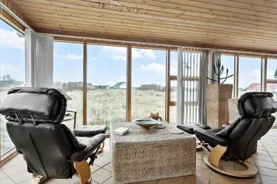 a living room with two chairs and a table at 529-Thisted-Nordsovej-24 in Thisted