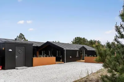 a black house with a black garage at 729-Thisted-Nordsovej-182 in Thisted