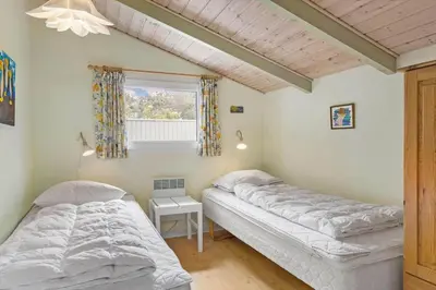 two beds in a room with a window at 531-Thisted-Ingerslevvej-5 in Thisted