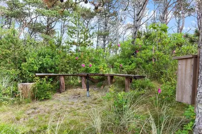a wooden bench sitting on top of a hill at 531-Thisted-Ingerslevvej-5 in Thisted
