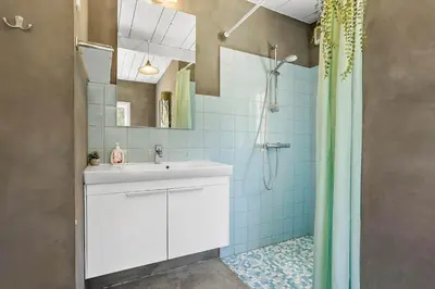 a bathroom with a white sink and a shower at 151-Thisted-Havbovej-39 in Thisted