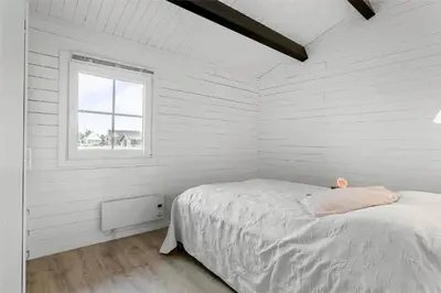 a white bedroom with a bed and a window at 567-Thisted-Fiskervej-67 in Thisted