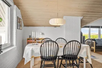 a dining room with a white table and chairs at 382-Thisted-Kristinesvej-2 in Thisted