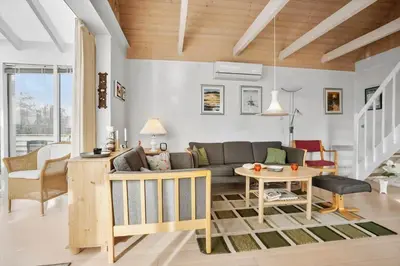 a living room with a couch and a table at 1332-Thisted-Flyndervej-22 in Thisted