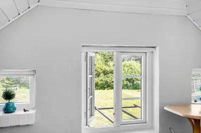 a white room with two windows and a table at 1329-Thisted-Nordsovej-226 in Thisted