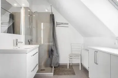 a white bathroom with a shower and a sink at 1340-Thisted-Nordsovej-104 in Thisted