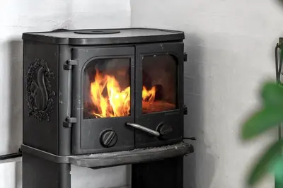 a wood stove with a fire in it at 1342-Thisted-Mose-Bolle-Vej-8 in Thisted
