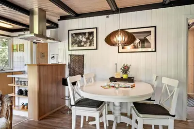 a dining room with a white table and chairs at 1344-Vestervig-Hedevej-43 in Vestervig
