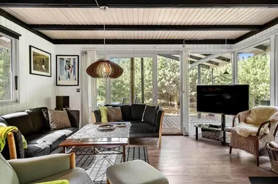 a living room with couches and a flat screen tv at 1344-Vestervig-Hedevej-43 in Vestervig