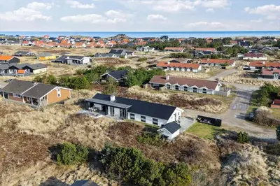 an aerial view of a residential neighborhood with houses at 1064-Thisted-Klitstien-25 in Torsted