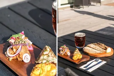 a table with a plate of food and a glass of beer at 1346-Vestervig-Havnevej-1-lejl-15 in Vestervig