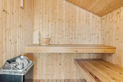 a wooden sauna with a shelf and a trash can at 148-Thisted-Fiskervej-74 in Thisted