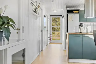 a kitchen with white walls and a blue refrigerator at 148-Thisted-Fiskervej-74 in Thisted