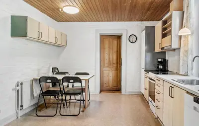 a kitchen with a table and chairs in it at Lovely Home In Thyholm With Wifi in Thyholm