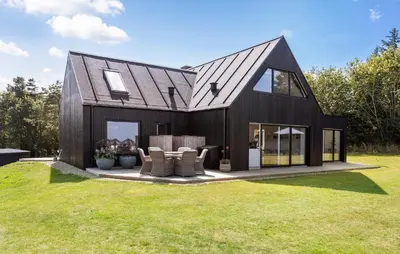 a black house with a gambrel roof at 4 Bedroom Cozy Home In Fur in Fur