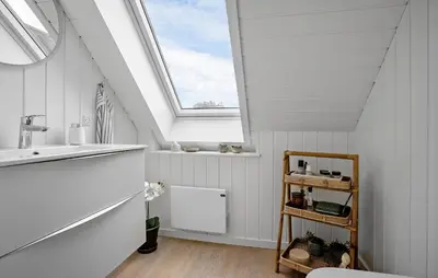 a bathroom with a sink and a skylight at 4 Bedroom Cozy Home In Fur in Fur