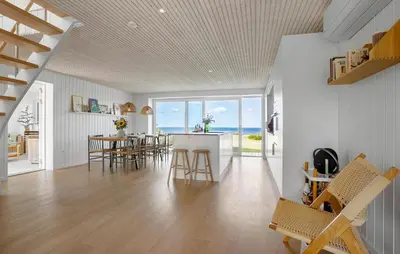 a kitchen and dining room with a view of the ocean at 4 Bedroom Cozy Home In Fur in Fur