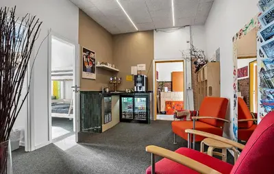 a waiting room with red chairs and a counter at Pet Friendly Home In Spøttrup With Wifi in Spottrup