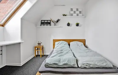 a bed in a room with white walls at Pet Friendly Home In Spøttrup With Wifi in Spottrup