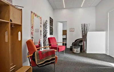an office with red chairs and a white wall at Pet Friendly Home In Spøttrup With Wifi in Spottrup