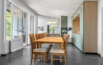 a dining room with a wooden table and chairs at Awesome Home In Spøttrup With Wifi in Spottrup