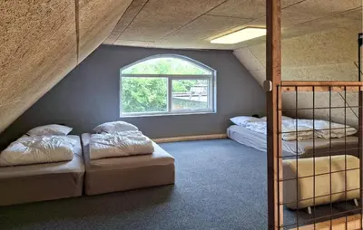 a room with two bunk beds and a window at 3 Bedroom Amazing Home In Erslev in Erslev