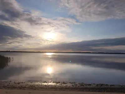 a sunset over a large body of water at 8 person holiday home in Skals-By Traum in Skals