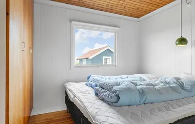 a bed in a room with a window at 4 Bedroom Beautiful Home In Thisted in Thisted