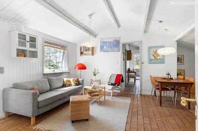 a living room with a couch and a table at 1333-Thisted-Sandtornvej-43 in Thisted