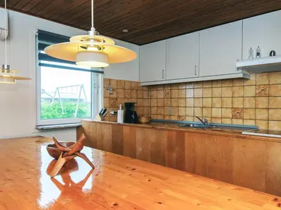a kitchen with a wooden table with a starfish on it at 10 person holiday home in Harboøre-By Traum in Harboør