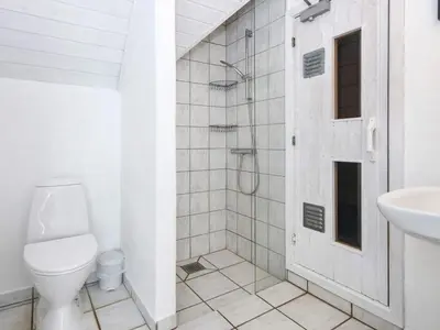 a white bathroom with a toilet and a sink at 12 person holiday home in Harboøre-By Traum in Harboør