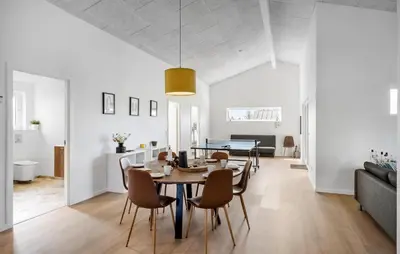 a dining room and living room with a table and chairs at Gorgeous Home In Saltum With Wifi in Saltum