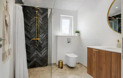 a bathroom with a shower with a toilet and a sink at Gorgeous Home In Saltum With Wifi in Saltum