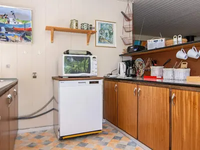 a kitchen with a white refrigerator and a microwave at 6 person holiday home in Højslev-By Traum in Højslev