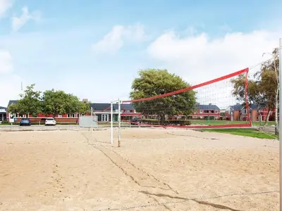 a volley ball net on a sandy field at 4-person cabin in Lemvig holiday park in Lemvig