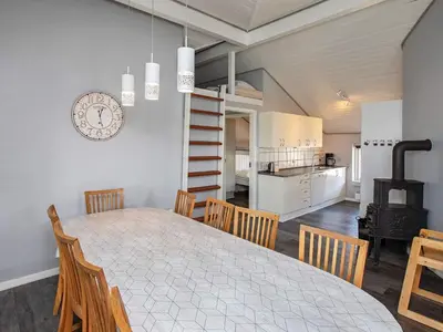 a dining room and kitchen with a table and chairs at 12 person holiday home in Vestervig-By Traum in Vestervig