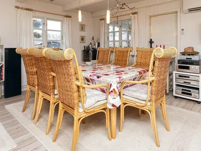 a dining room with a table and chairs at 6 person holiday home in Thyholm-By Traum in Thyholm