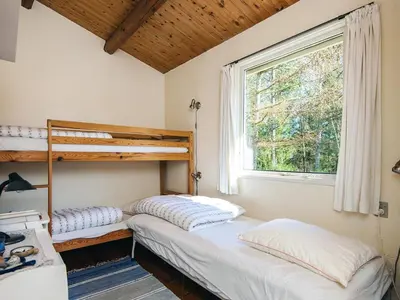 two bunk beds in a room with a window at 5 person holiday home in Højslev-By Traum in Højslev