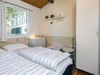 a bedroom with a large bed and a window at 5 person holiday home in Højslev-By Traum in Højslev