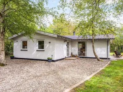 a white house with a gravel yard at 7 person holiday home in Hurup Thy-By Traum in Sønder Ydby