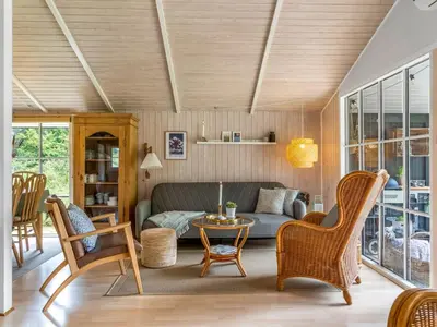 a living room with a couch and chairs and a table at Holiday Home Nahuel - 1km from the sea by Interhome in Blokhus