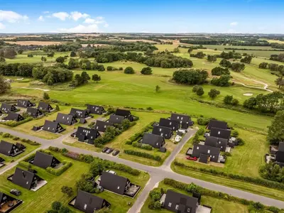an aerial view of a housing estate with houses at Holiday Home Ernstine by Interhome in Farsø